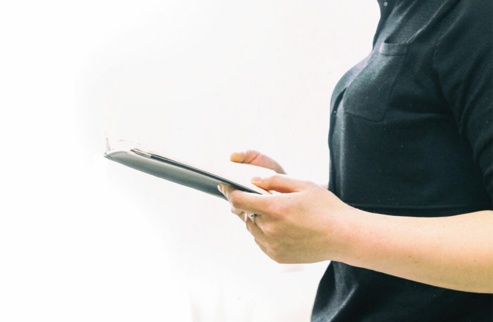 Woman standing and reading the bible