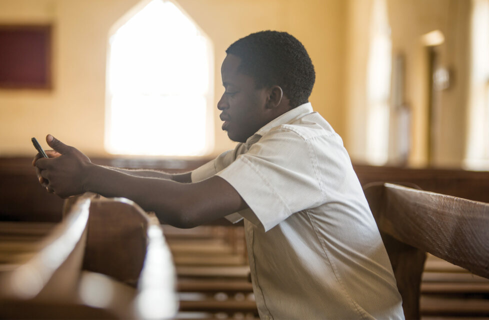 A man sitting in church praying