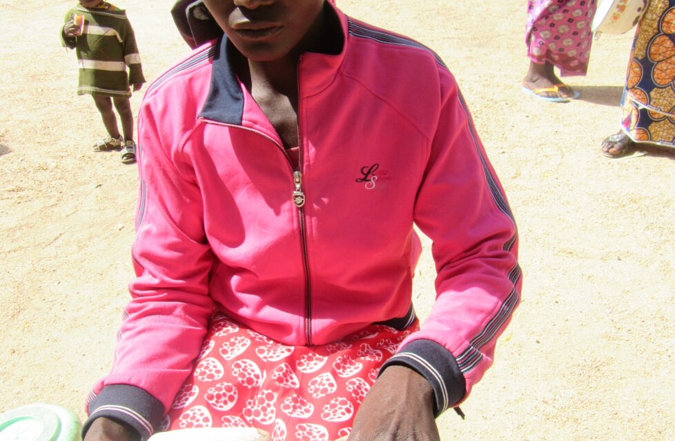 Nigerian girl sits reading her bible