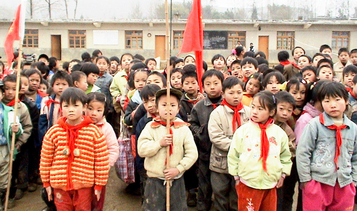 Chinese kids standing with flags