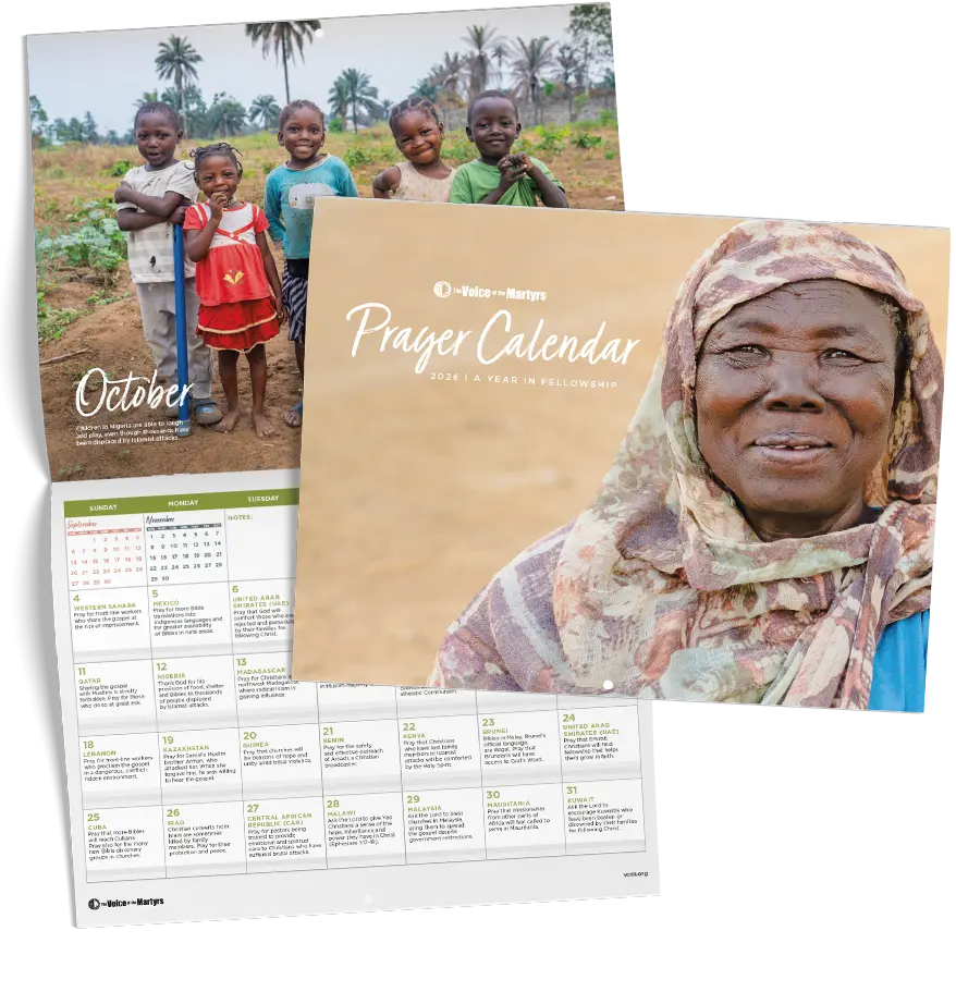 Front cover of calendar showing woman in prayer