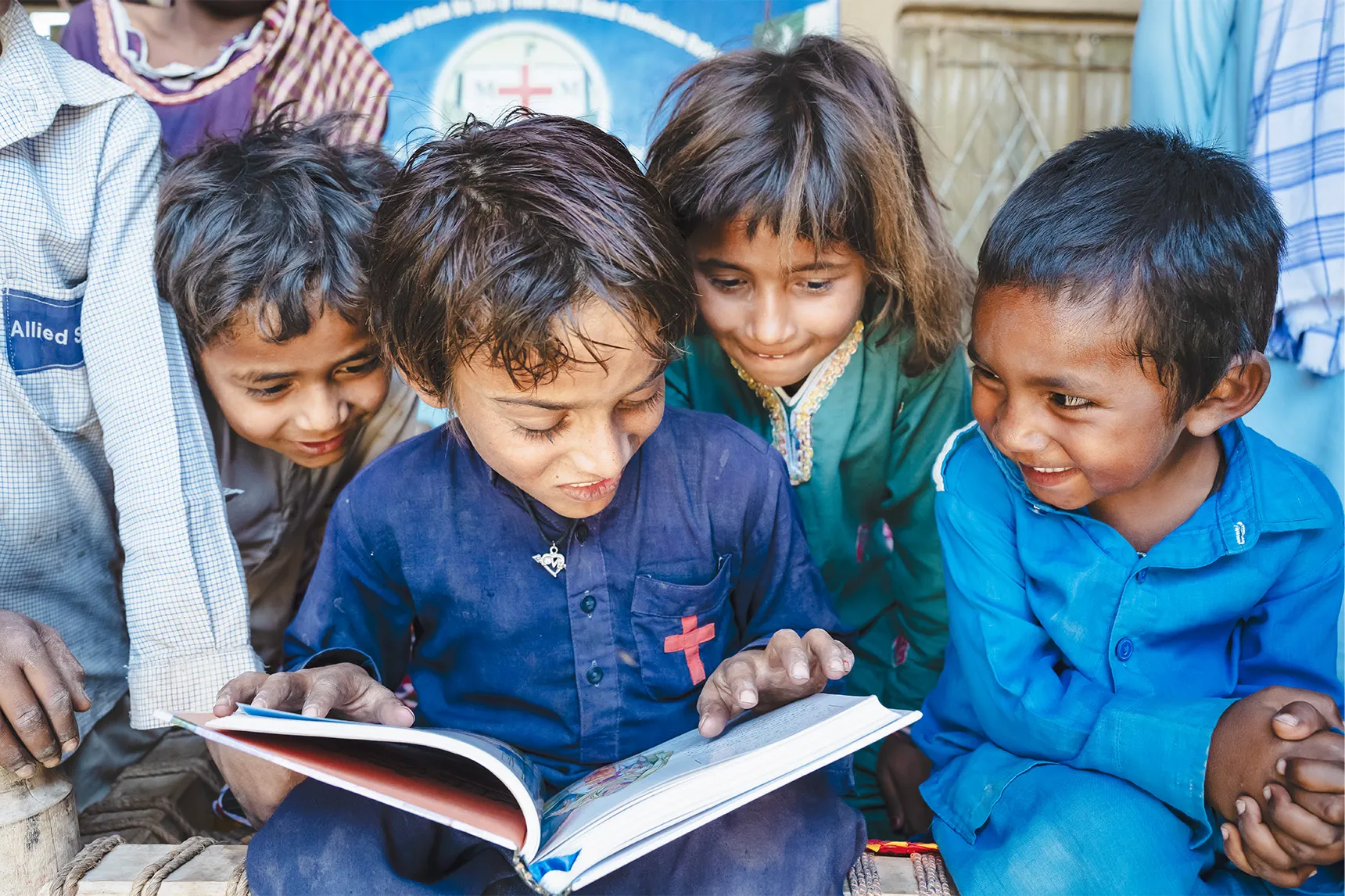 Kids reading a Bible