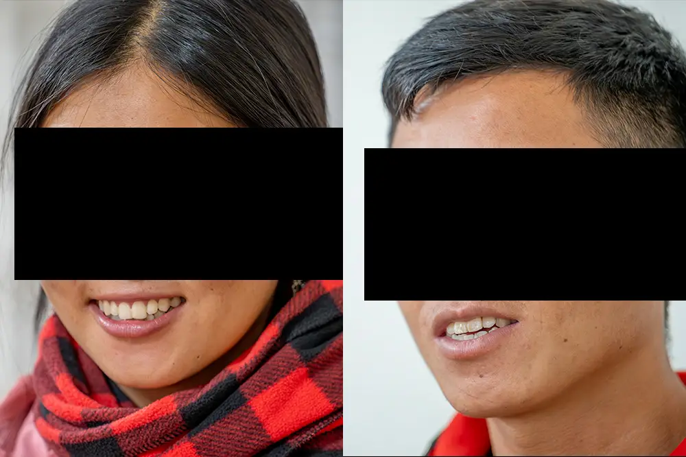 Two people with their faces covered for security reasons