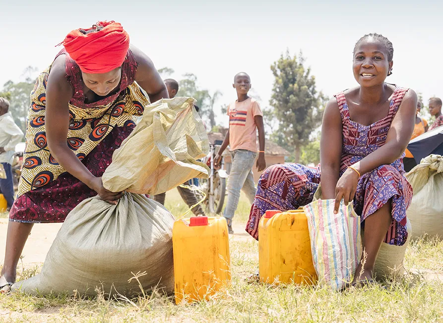 People filling water jugs