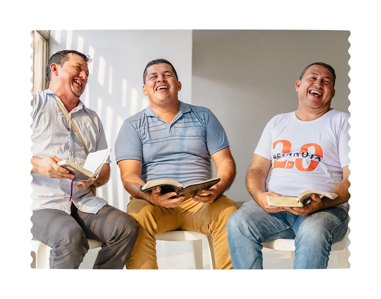 Three men sitting and talking