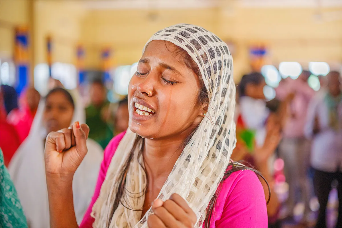 Woman crying in prayer
