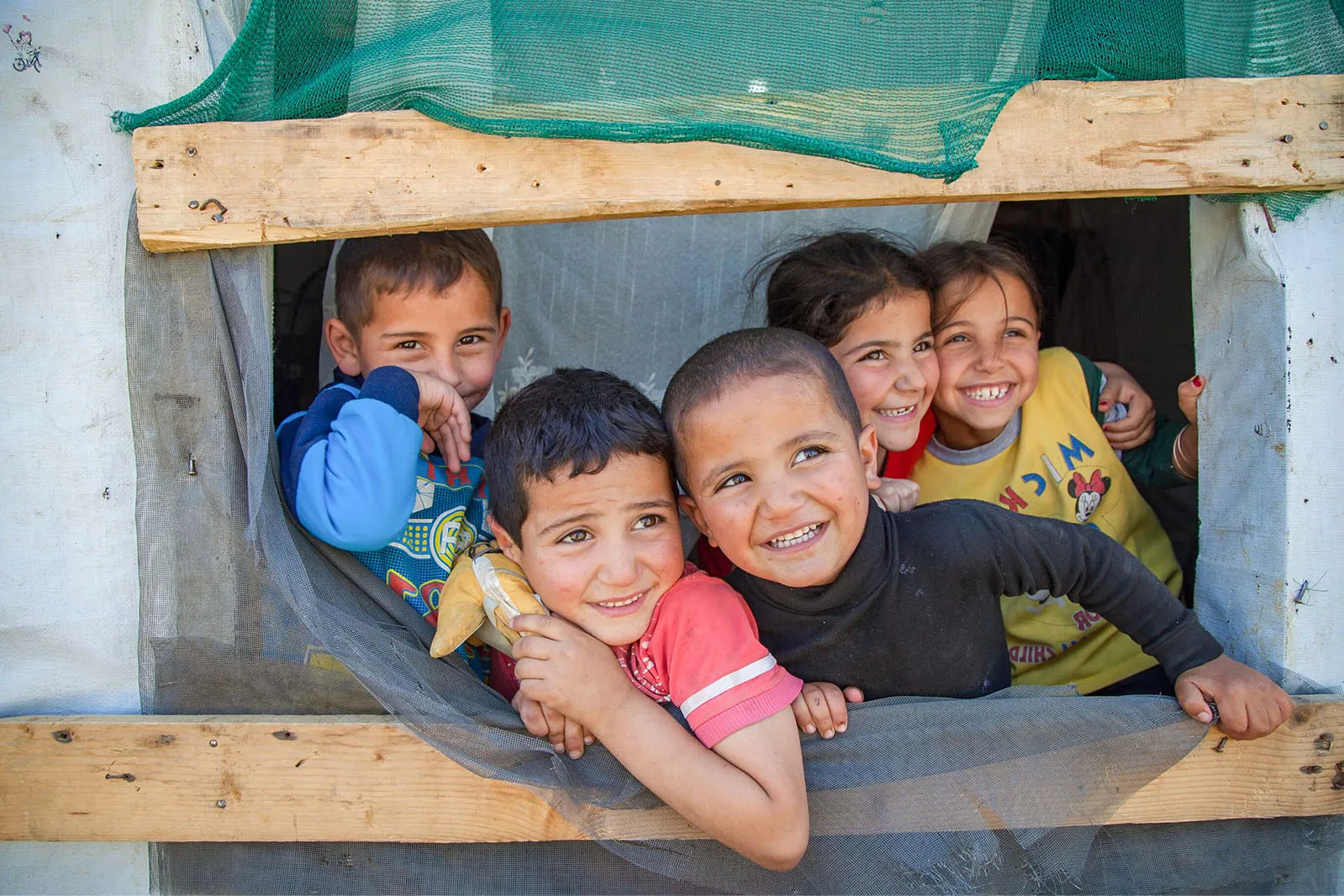 Kids looking through window
