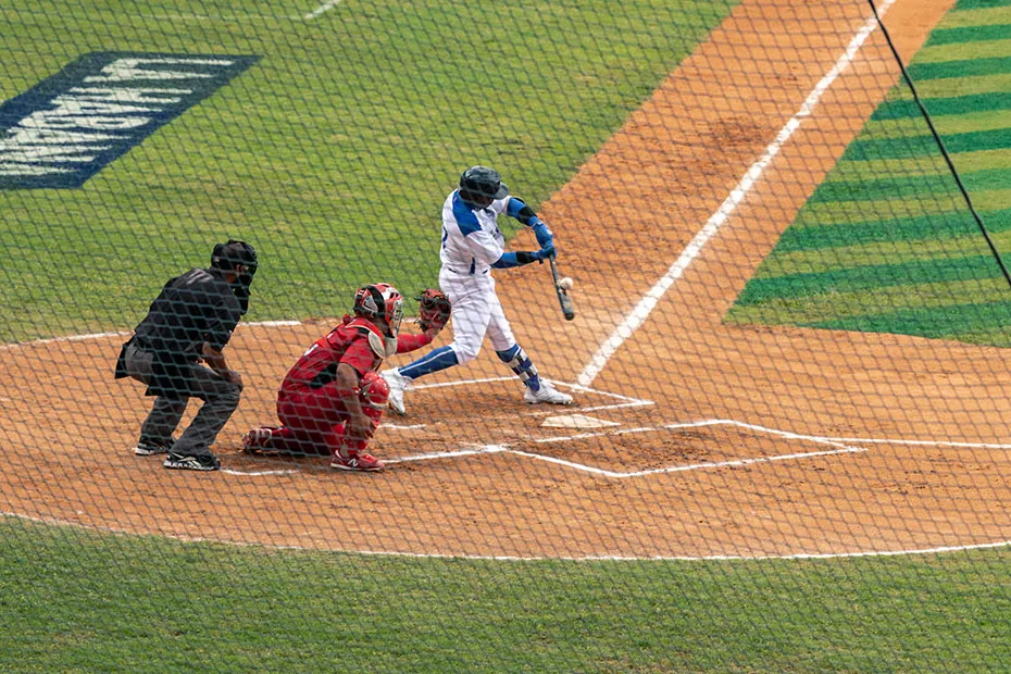 Batter swings at a baseball
