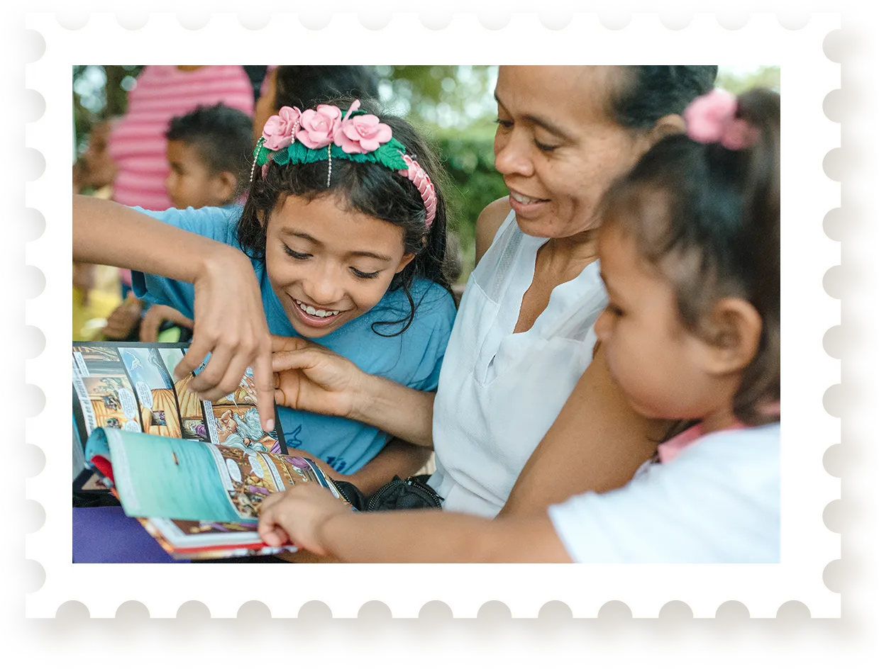 Woman reading Bible with children