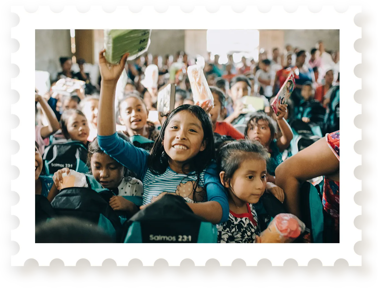 Group of kids smiling with backpacks