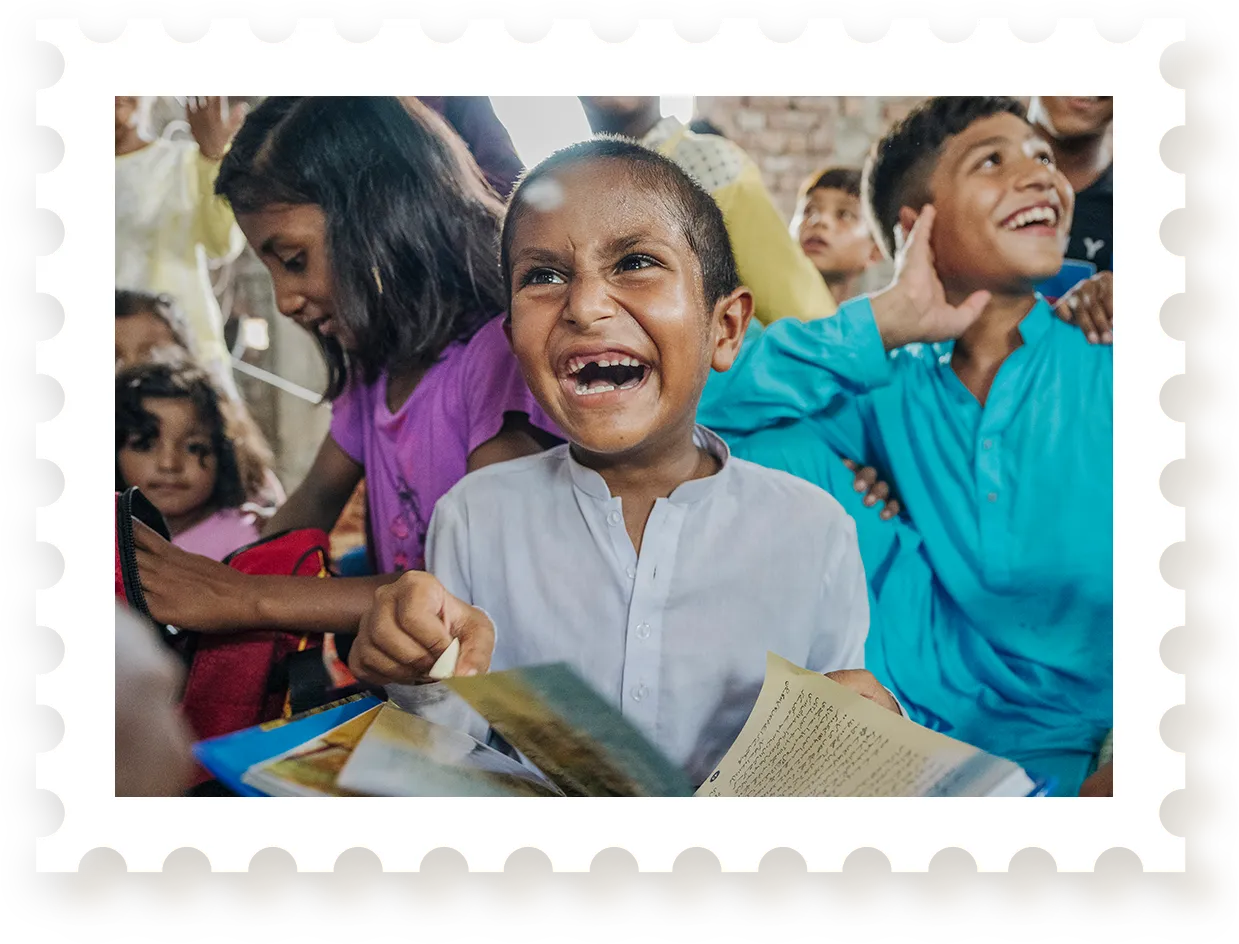 Girl with huge smile reading Bible