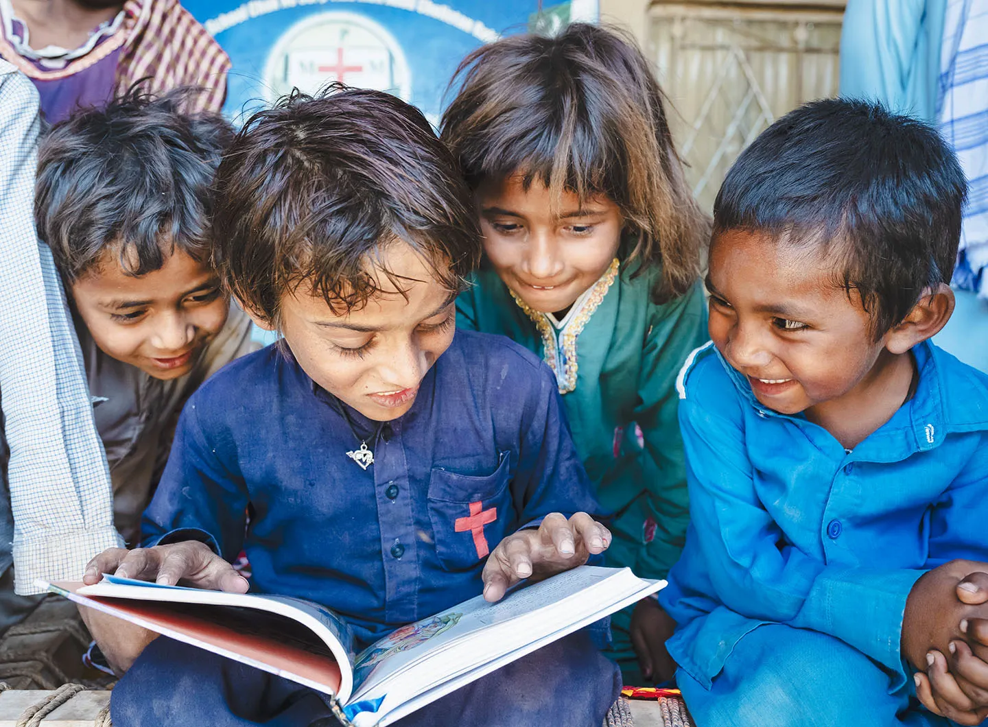 Kids reading a Bible