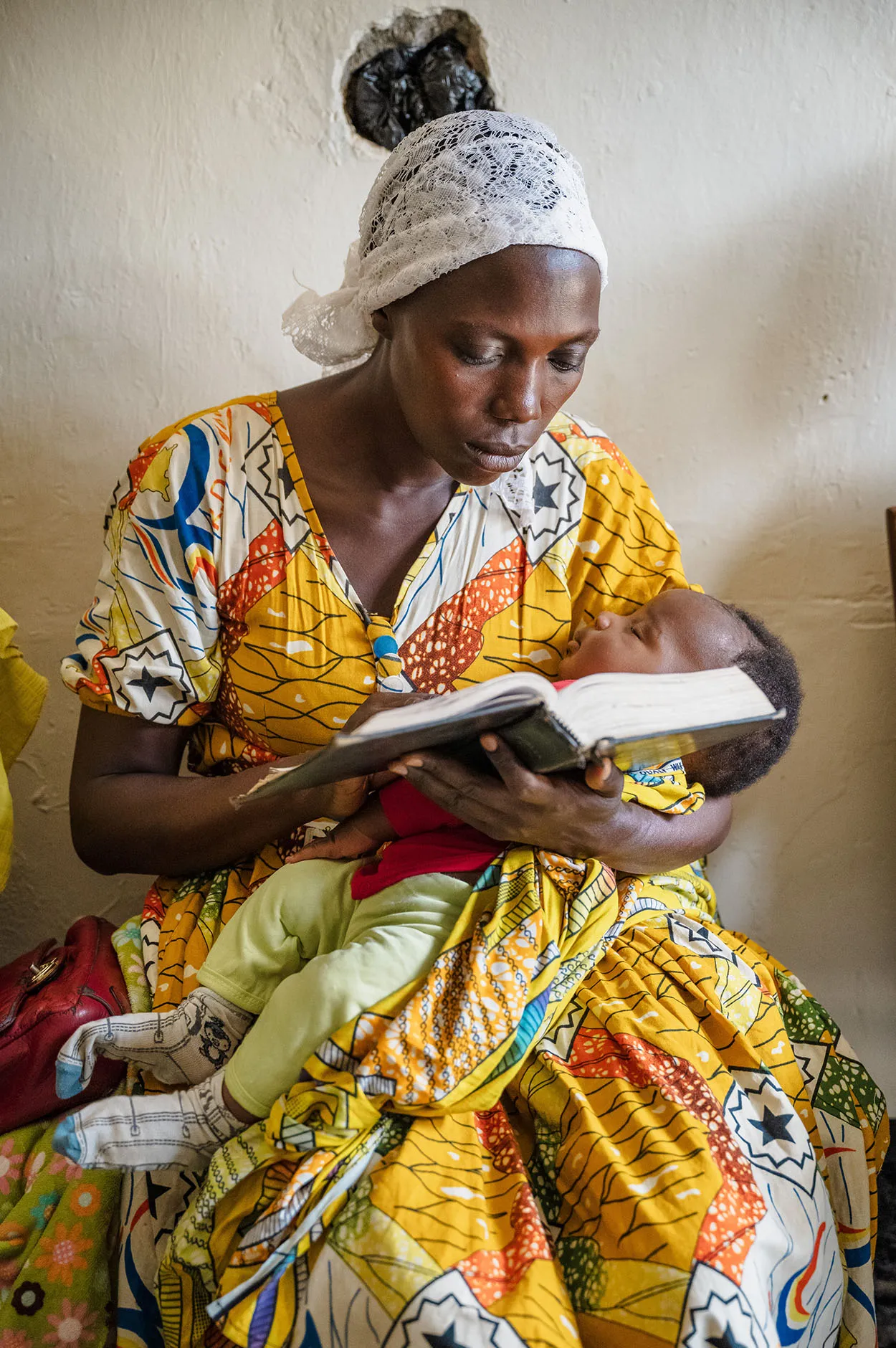 Woman and baby reading Bible