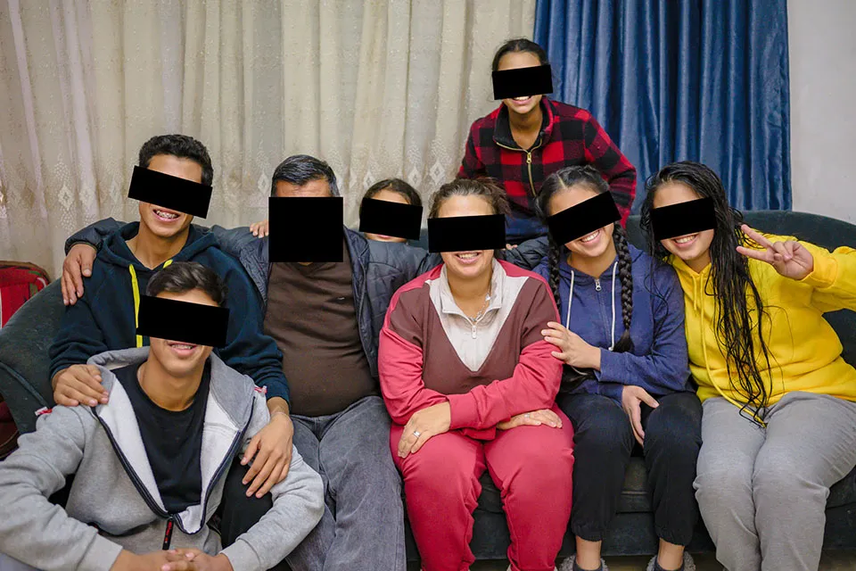 Group of people with faces redacted