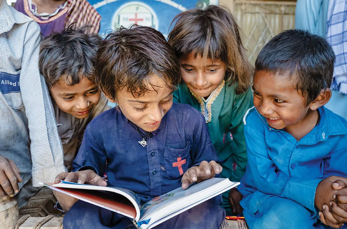 Kids reading a Bible