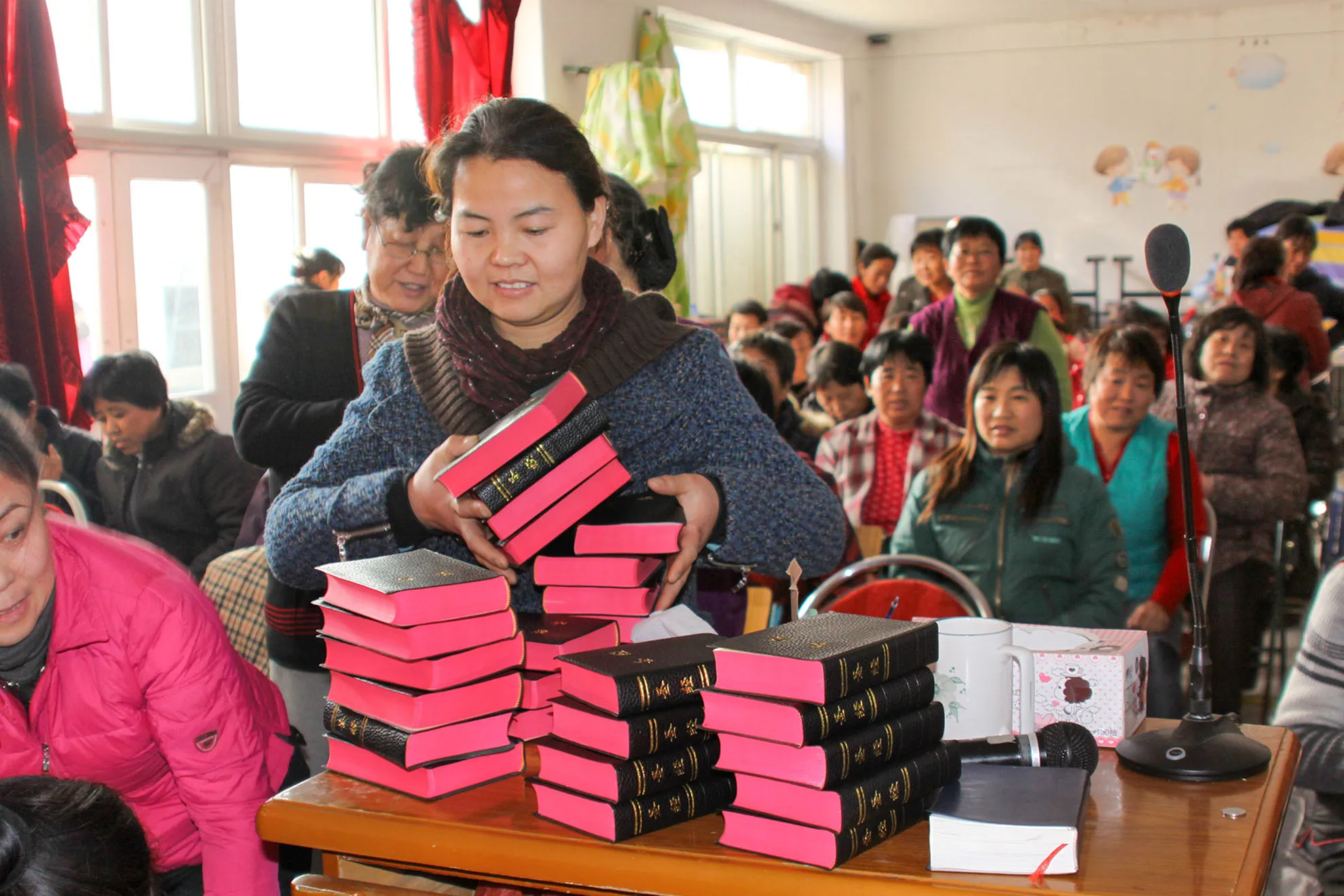 Two people walking beside a field