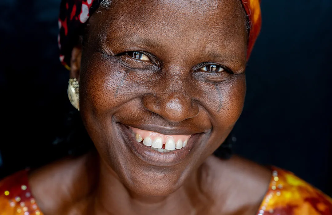Woman smiling in dark room