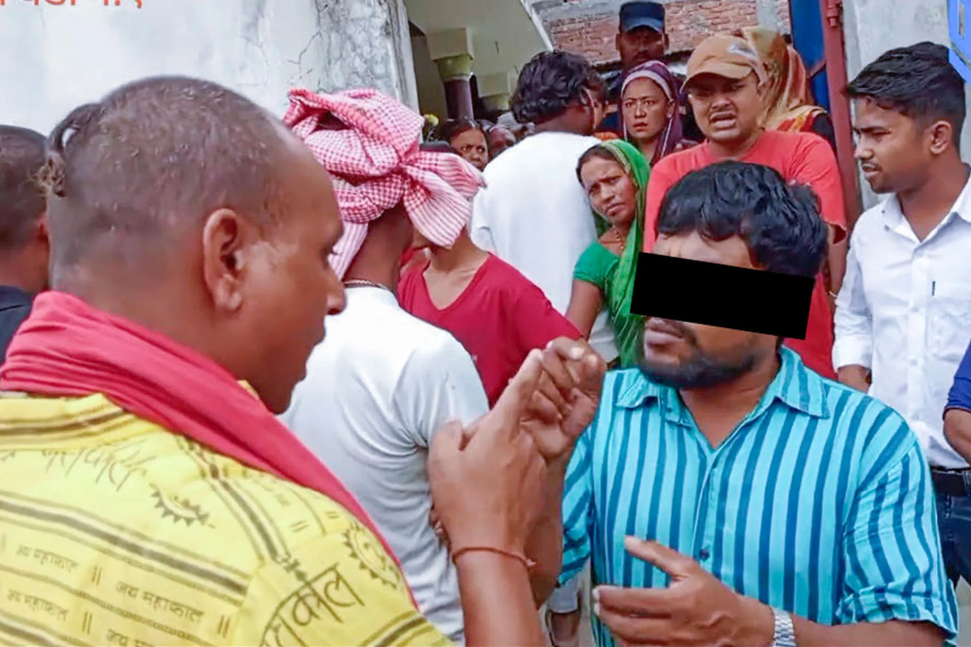 Two people talking in a crowd