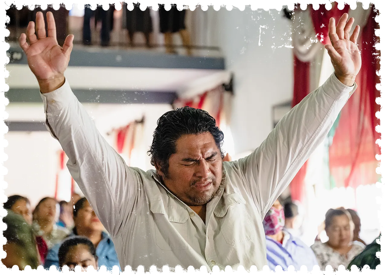 Man holding up his hands in worship