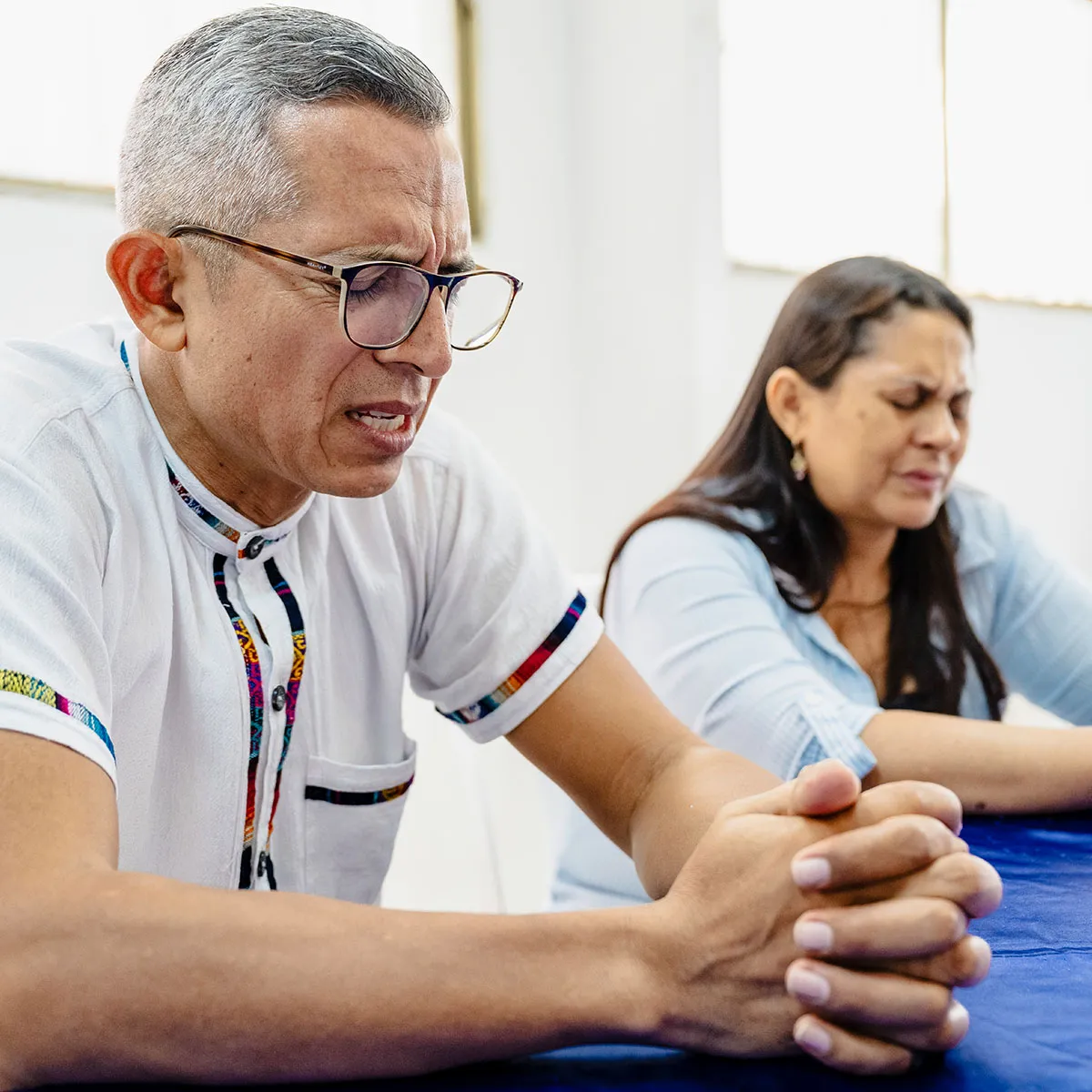 Man praying in group