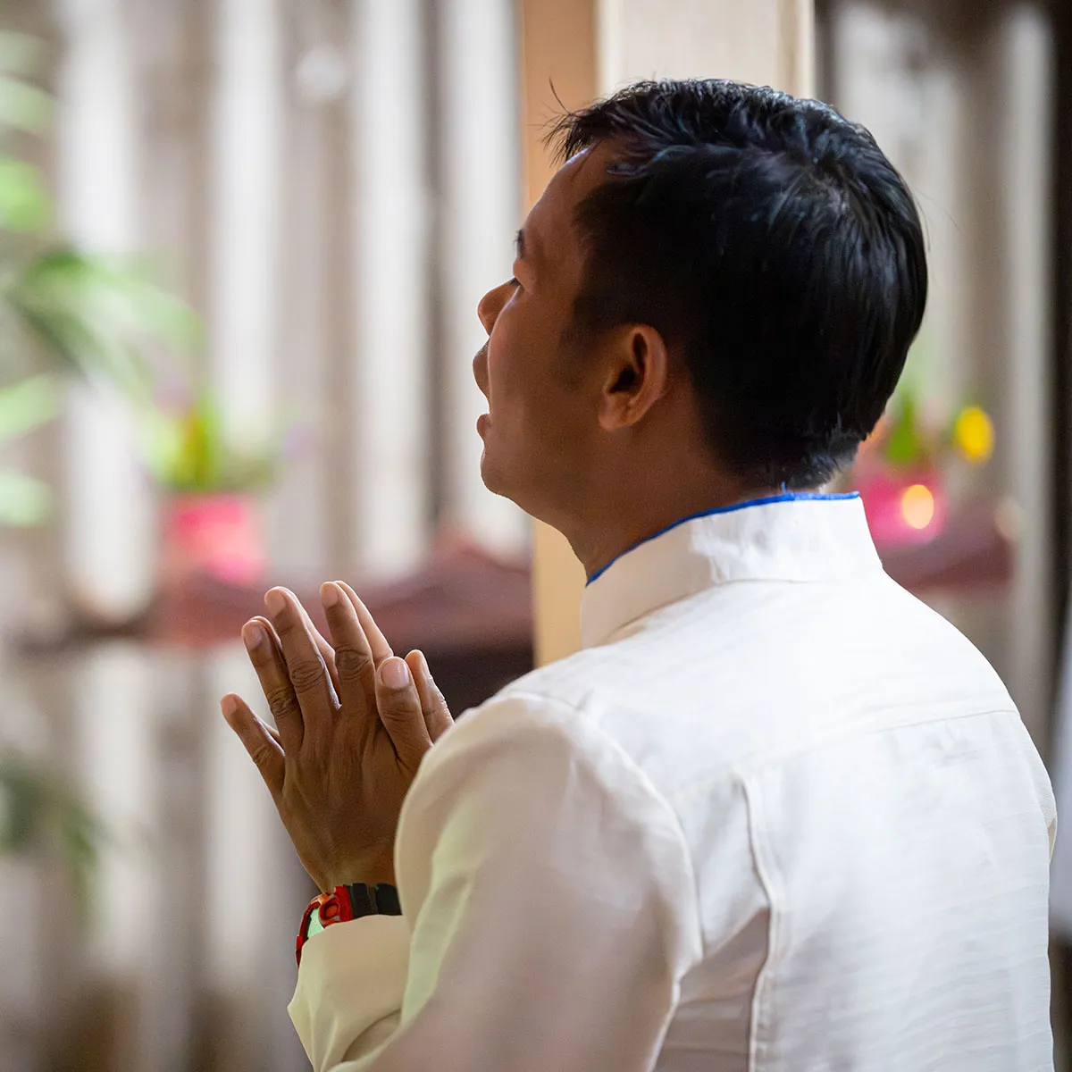 Man praying in a church