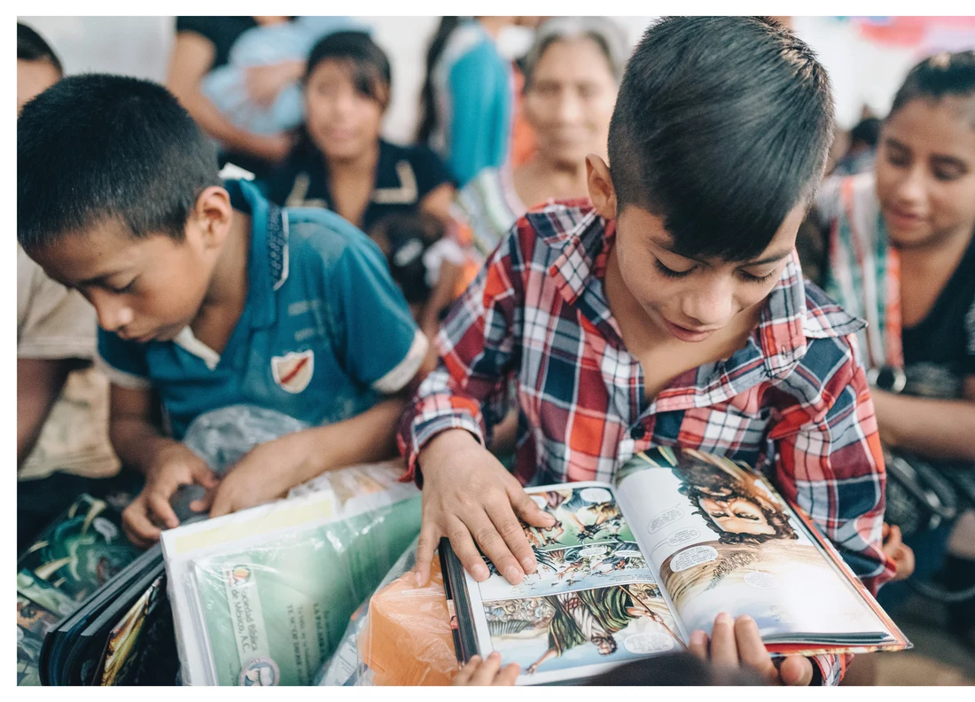 Children reading illustrated Bibles