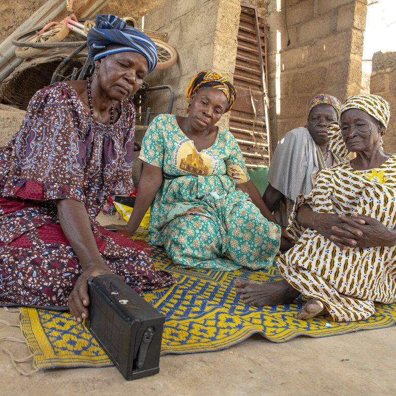 Women in Burkina Faso listening to an audio Bible