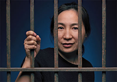 Woman behind prison bars
