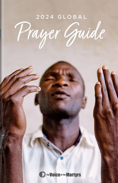 Cover of Prayer Guide with man praying next to a window