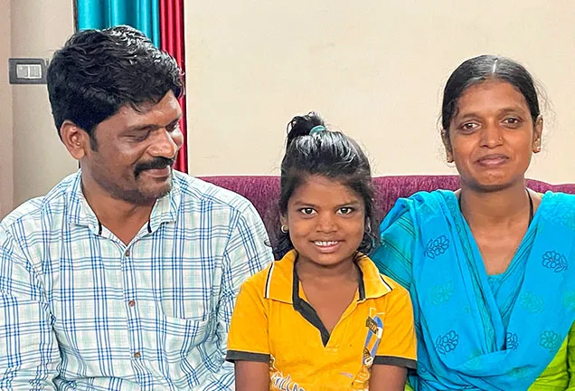 Three people smiling