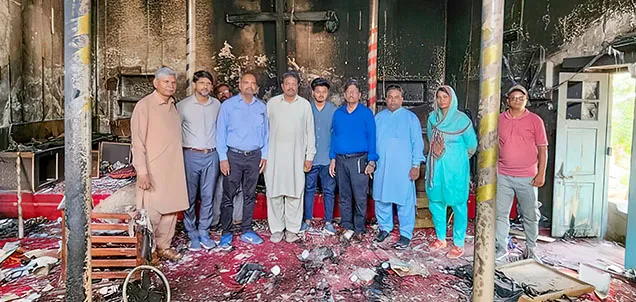 Group of people in burnt church