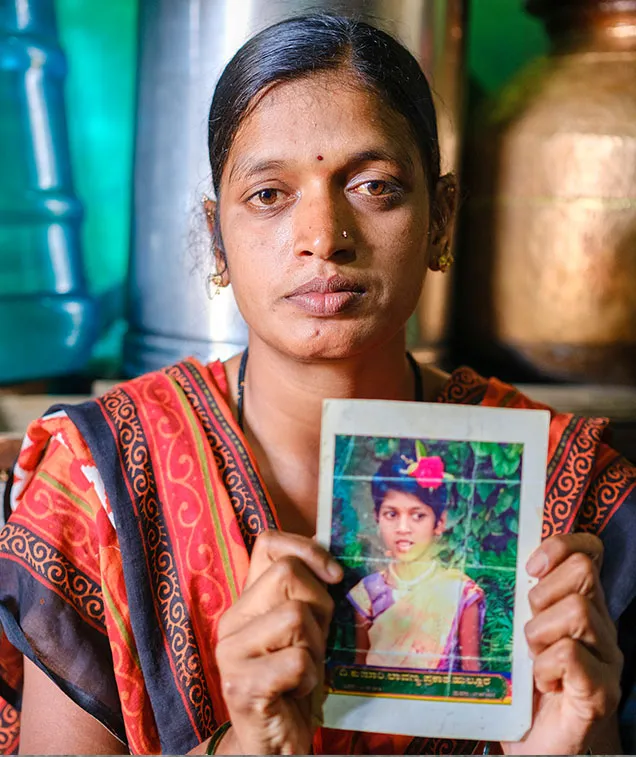 Woman holding photo of child