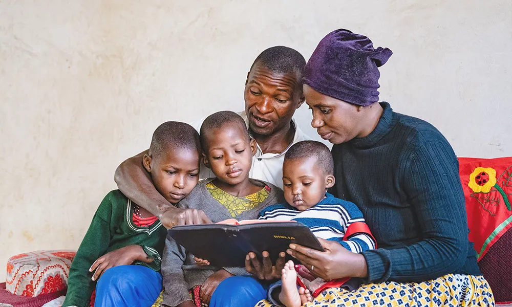 Family reading a Bible