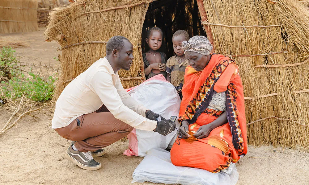 Man handing out supplies