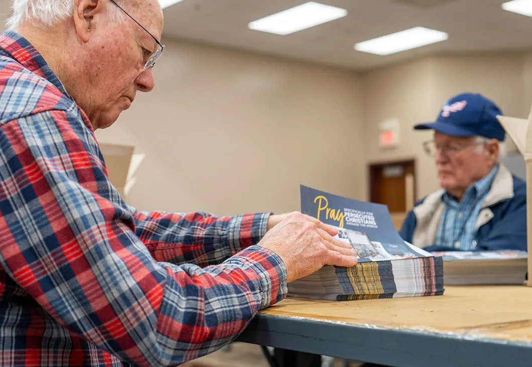 Men sorting papers