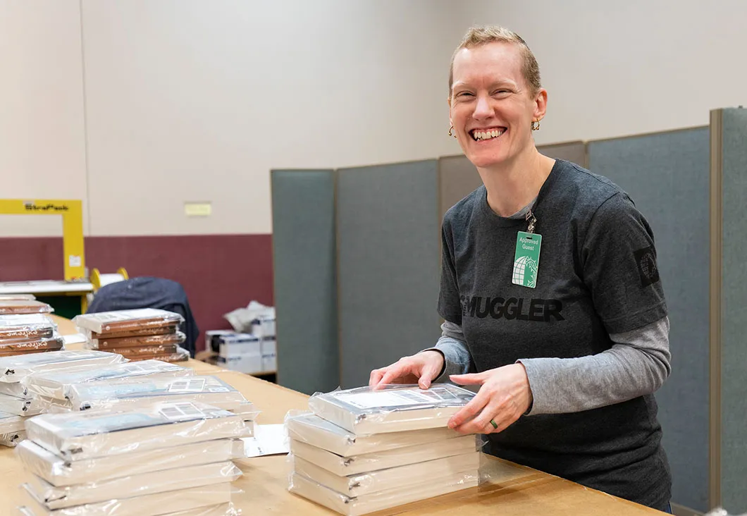 Volunteer stacking books