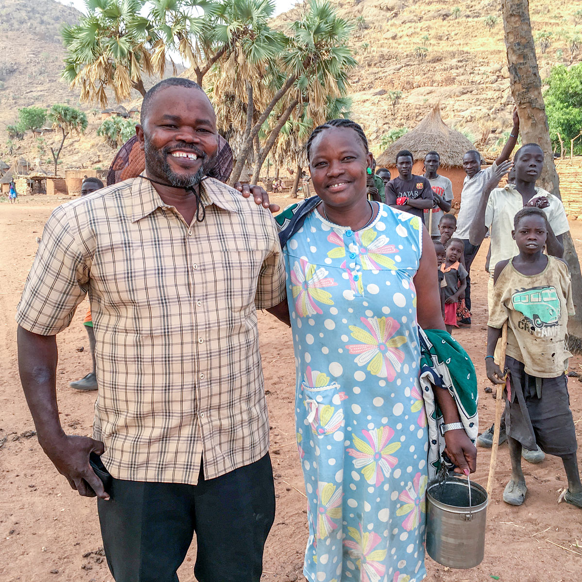 Morris and his wife in African village