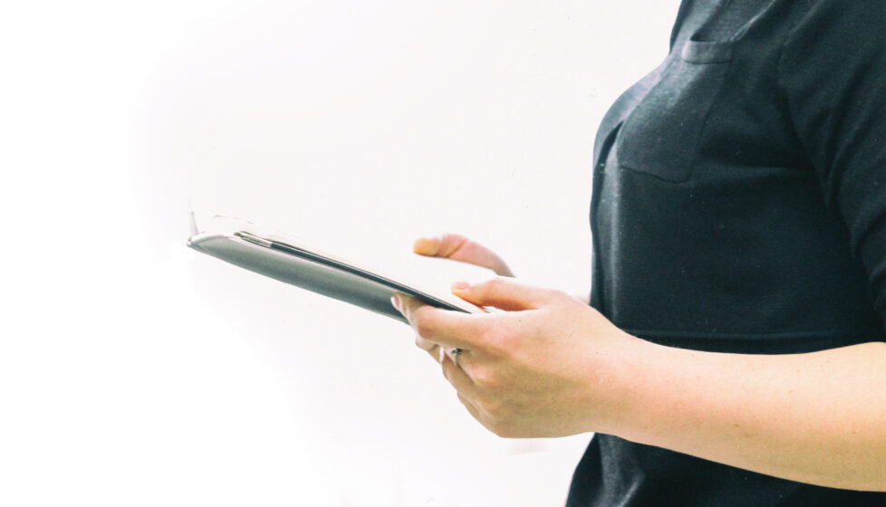 Woman standing and reading the bible