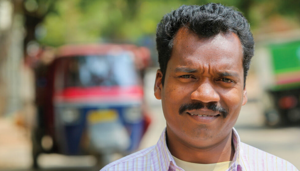 A man facing the camera smiling