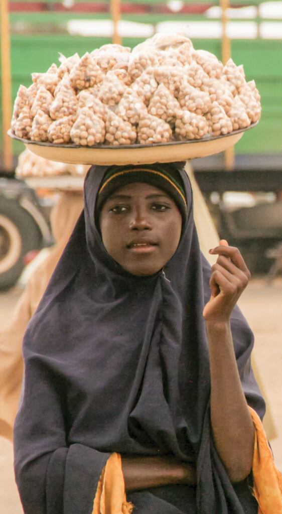 A woman carrying nuts