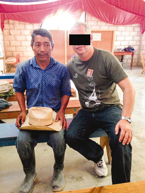 two men sitting in a church