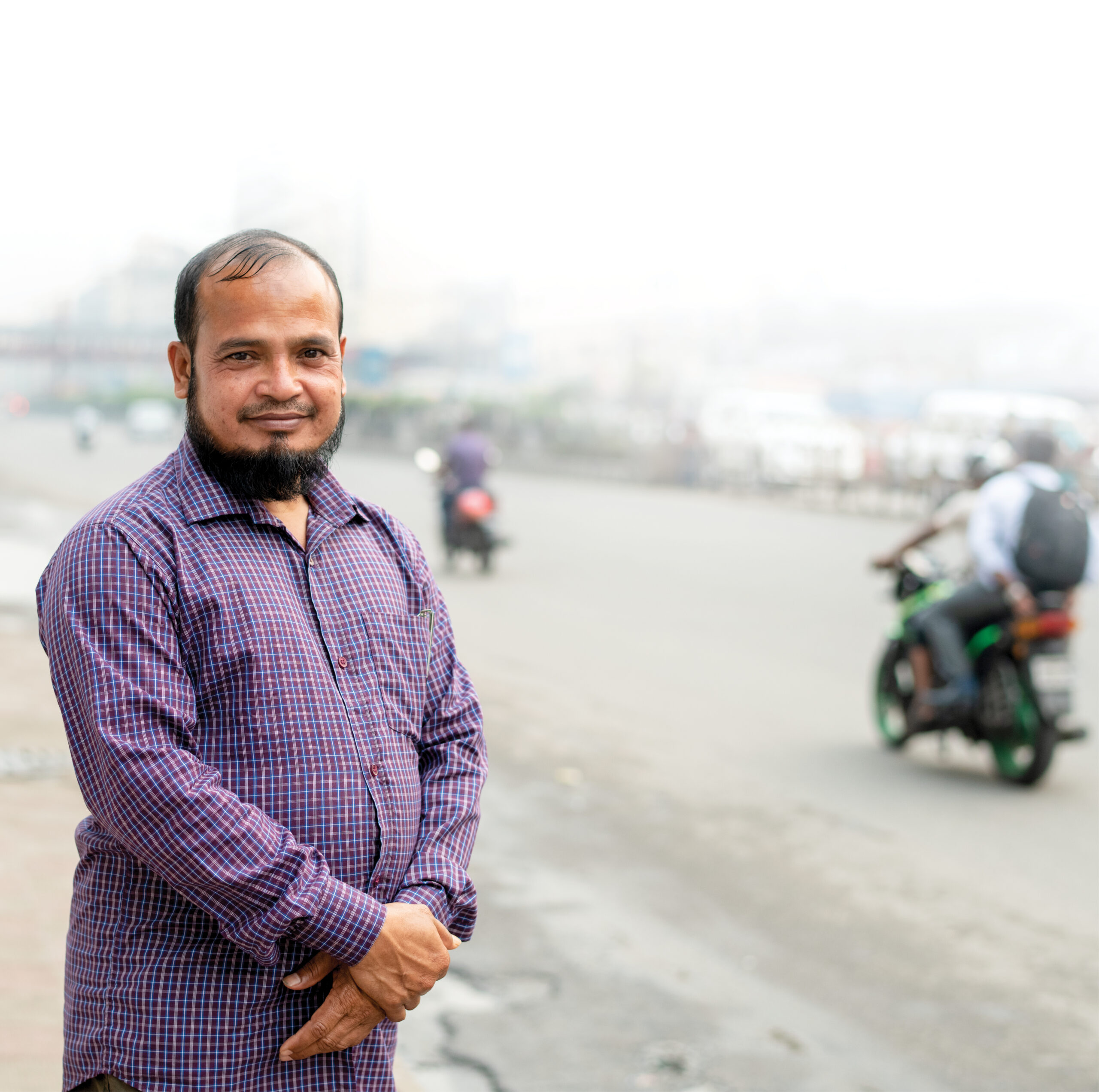 Man stands beside road