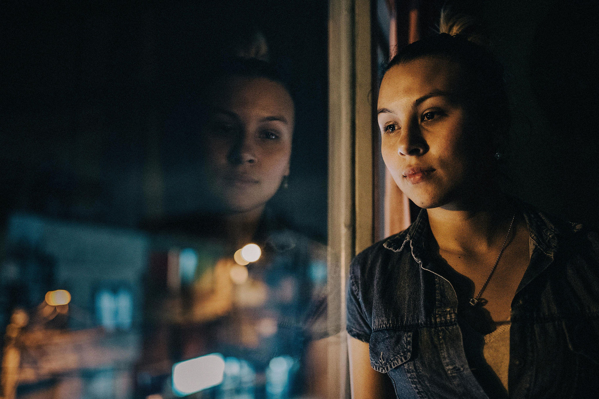 Daughter of Colombian martyr looks out window