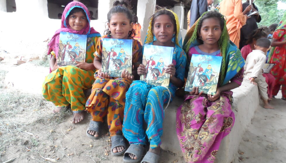 group of kids holding action packs