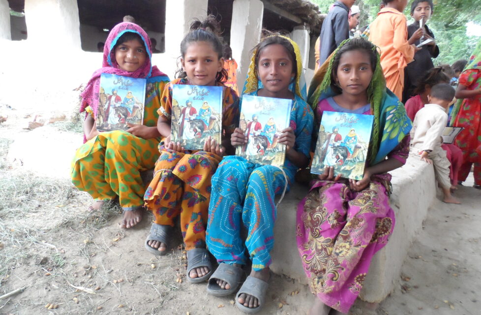 group of kids holding action packs