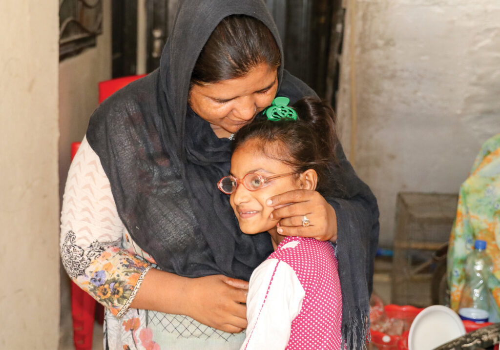 mother hugs her daughter