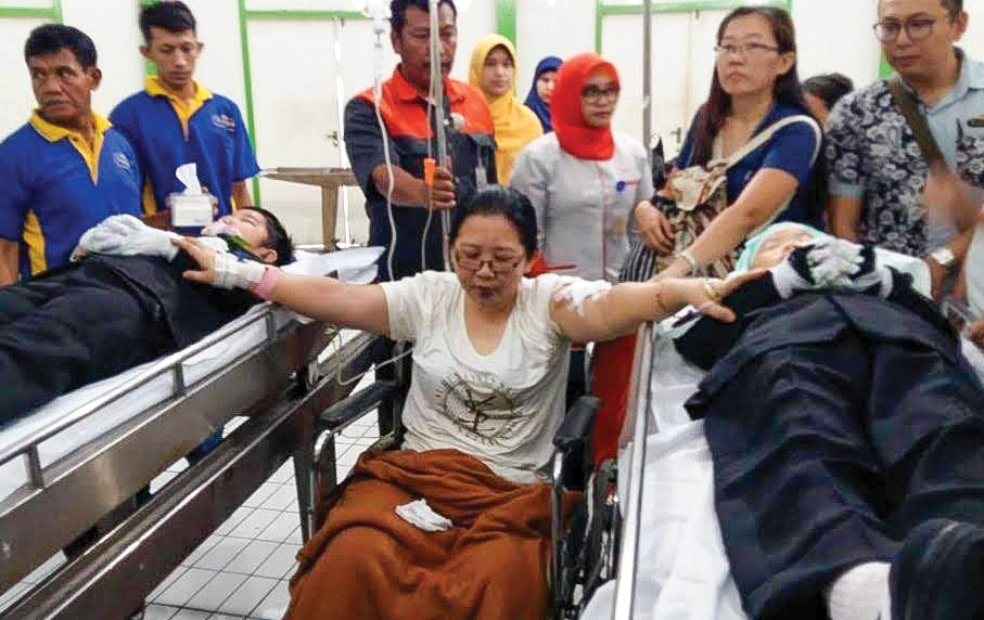 Bombing victim and her sons in a hospital.