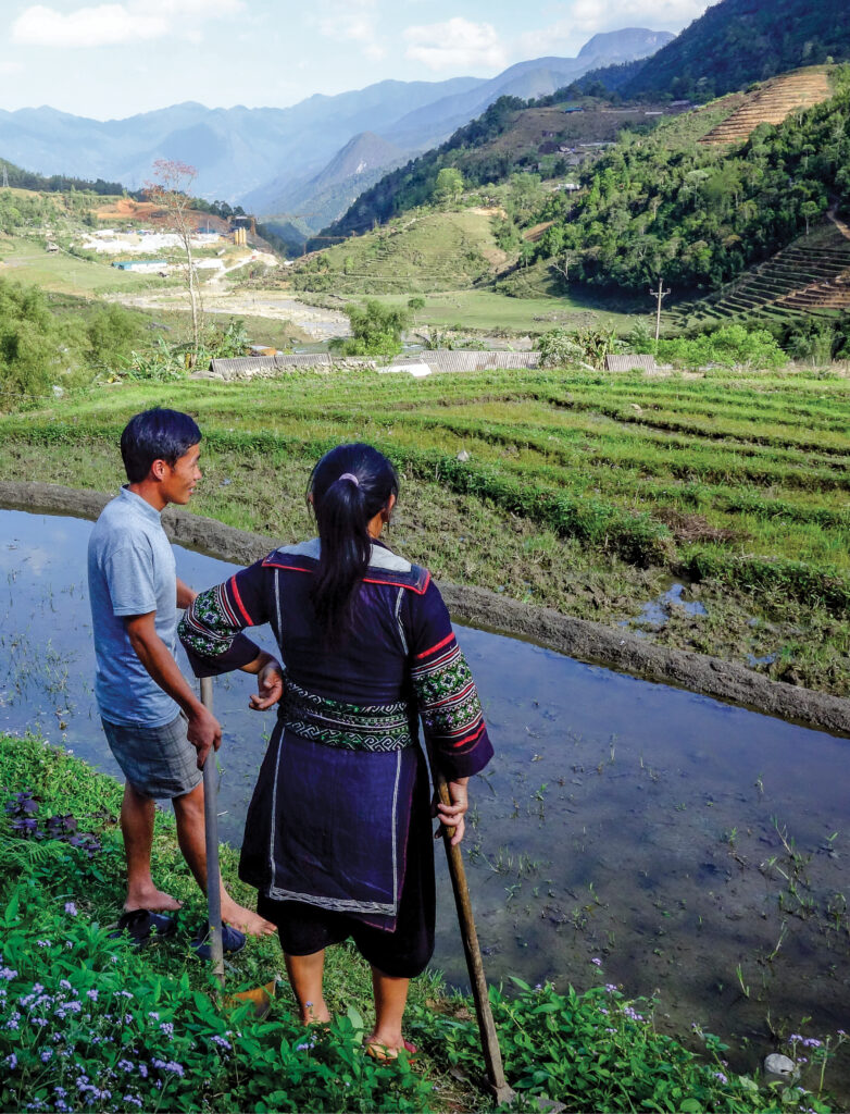 Couple looks over Vietnam countryside