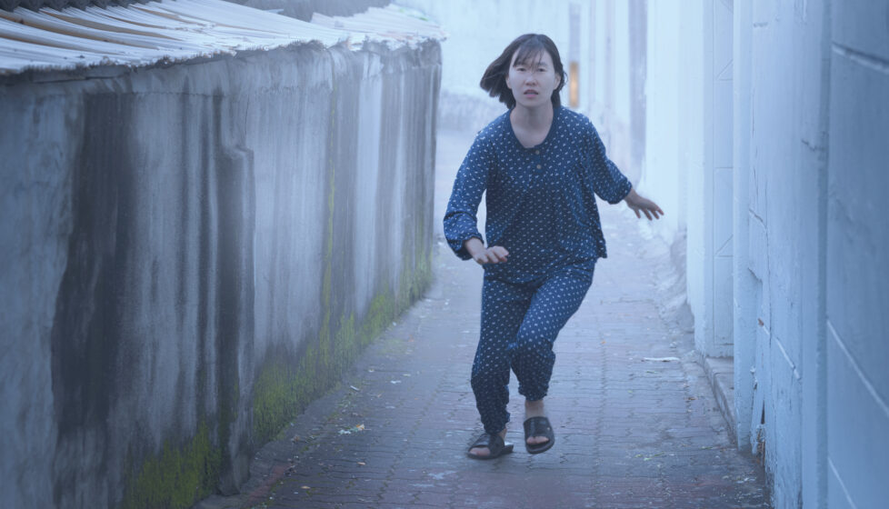 North Korean woman flees in pajamas