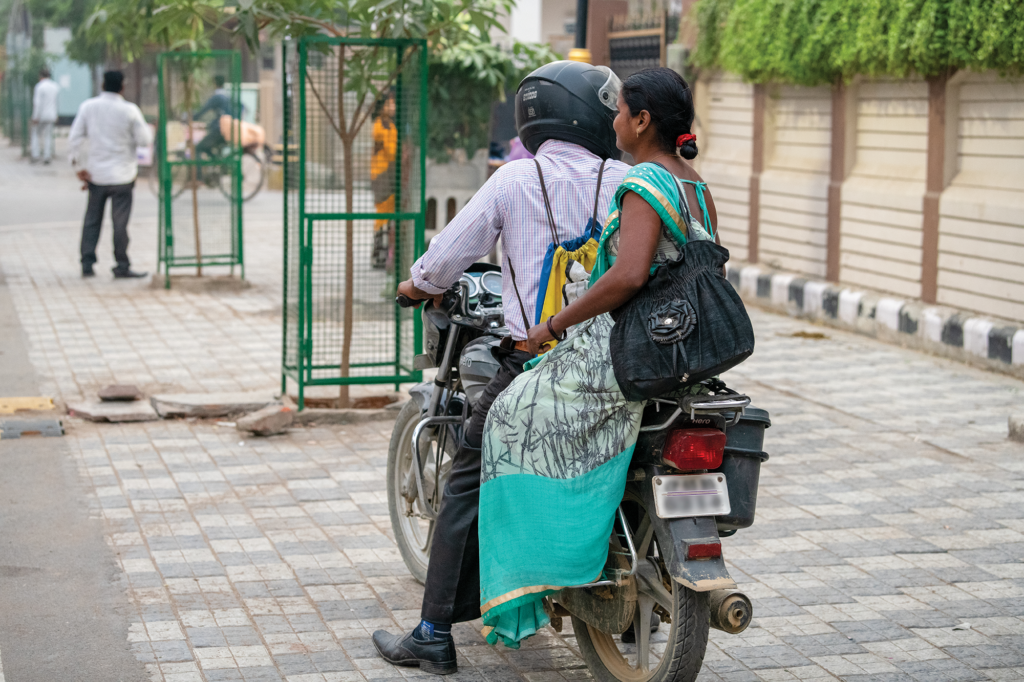 Indian man and woman on motorbike